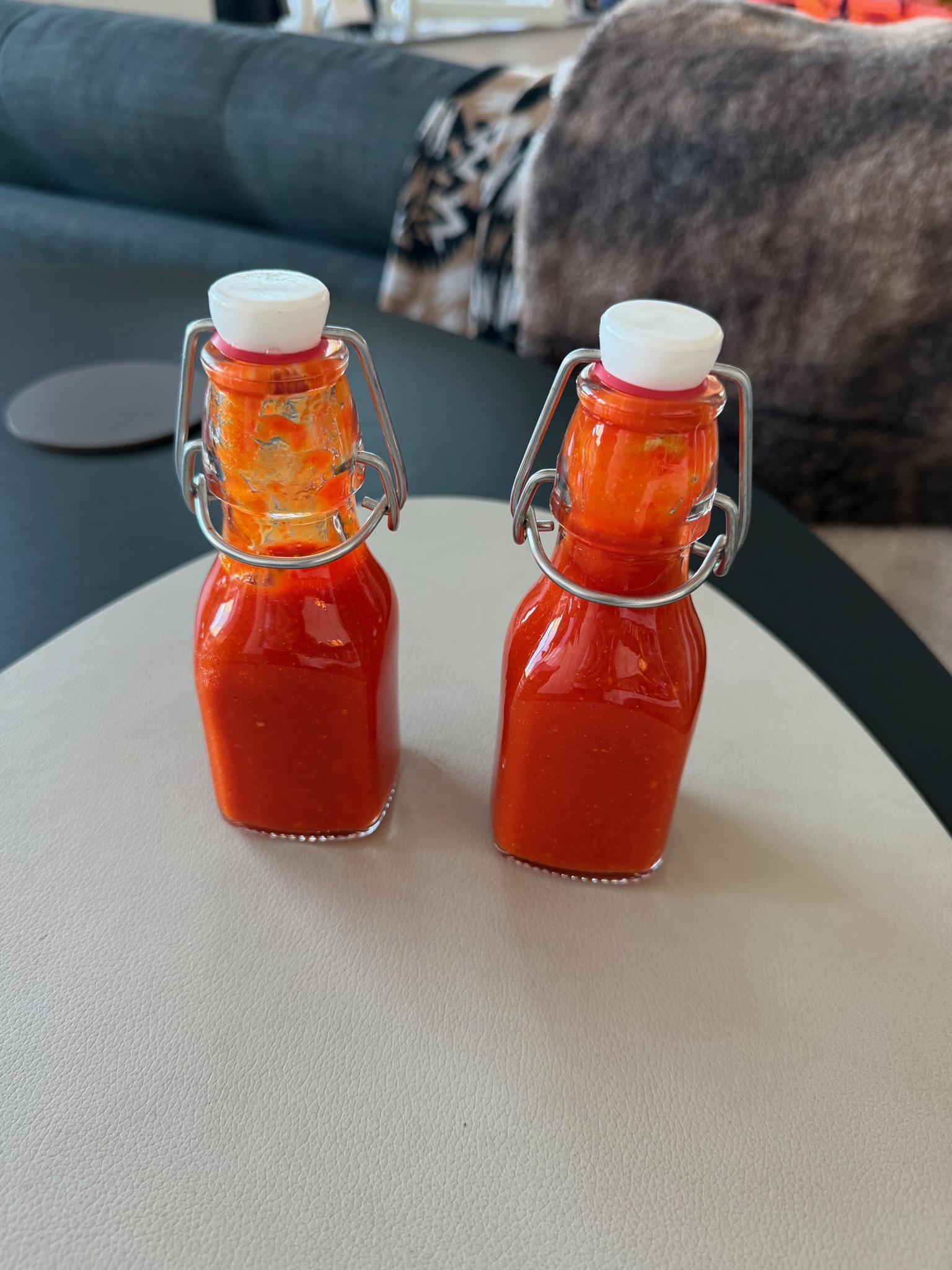 Two bottles of spicy homemade hot sauce