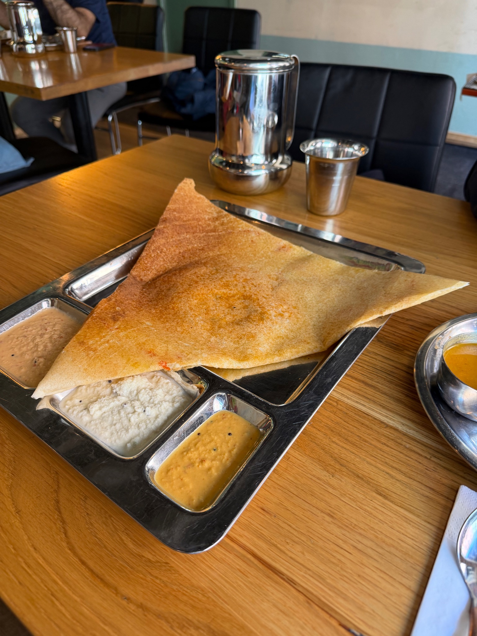 An enormous dosa at one of our favourite Indian restuarants called "Saravana Bhavan"