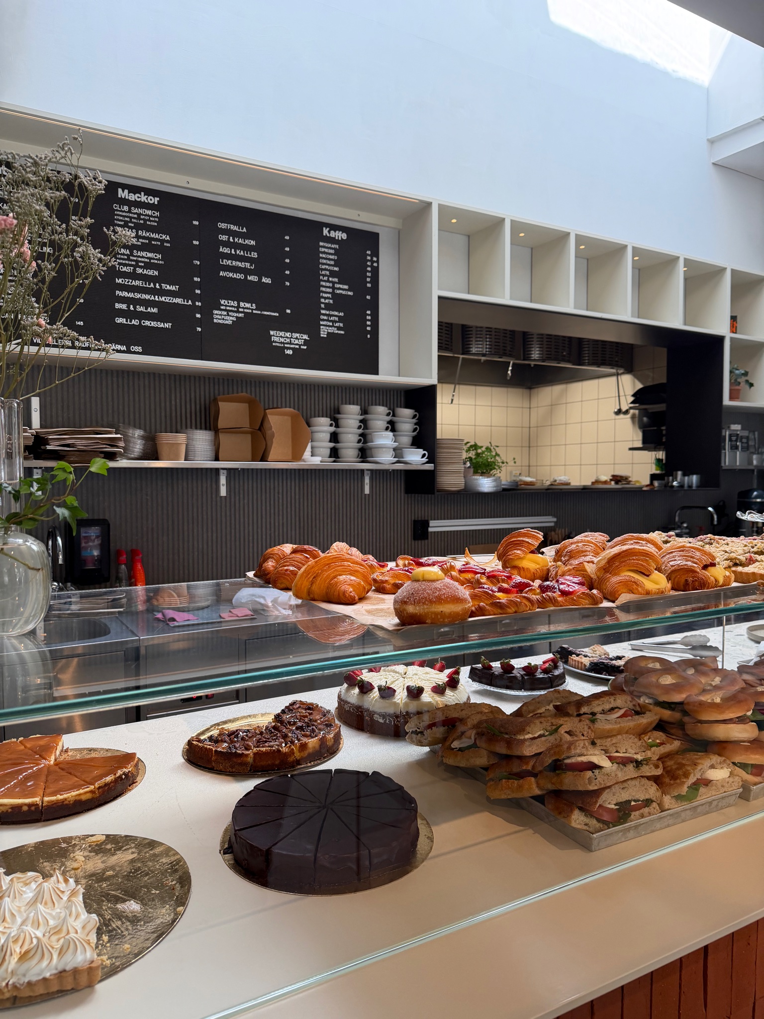 A café displaying baked goods in Hagastaden